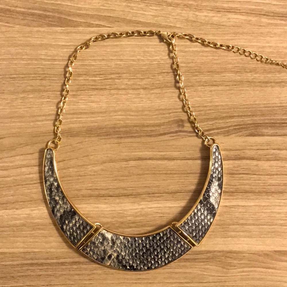 Snake skin pendant with gold accent hardware
